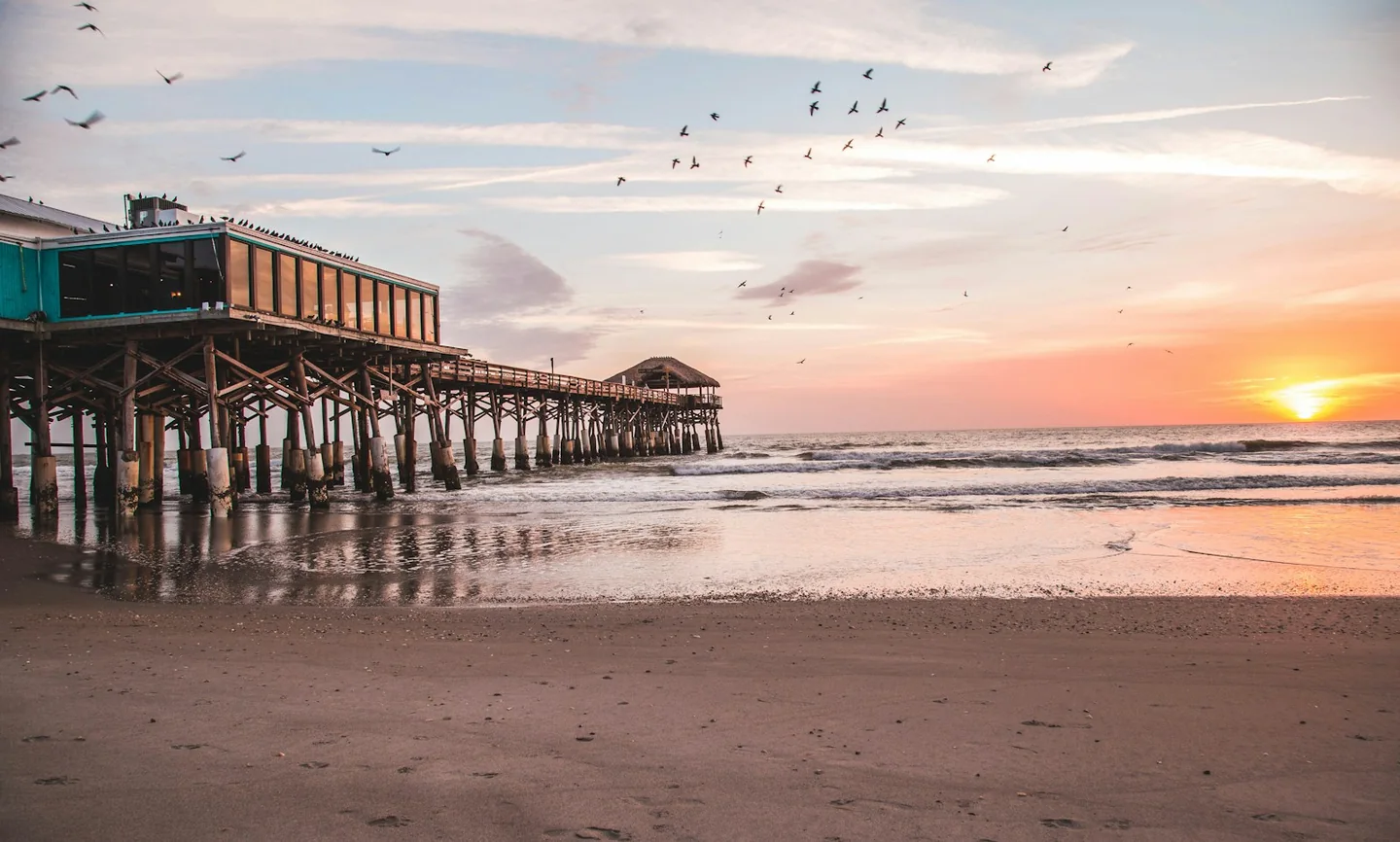 Cocoa Beach Pier and Atlantic shoreline at dusk
